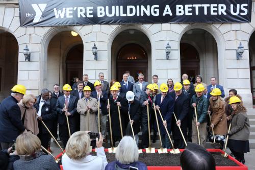 Project leaders gather with shovels to break ground at the new Kirk Family YMCA site.