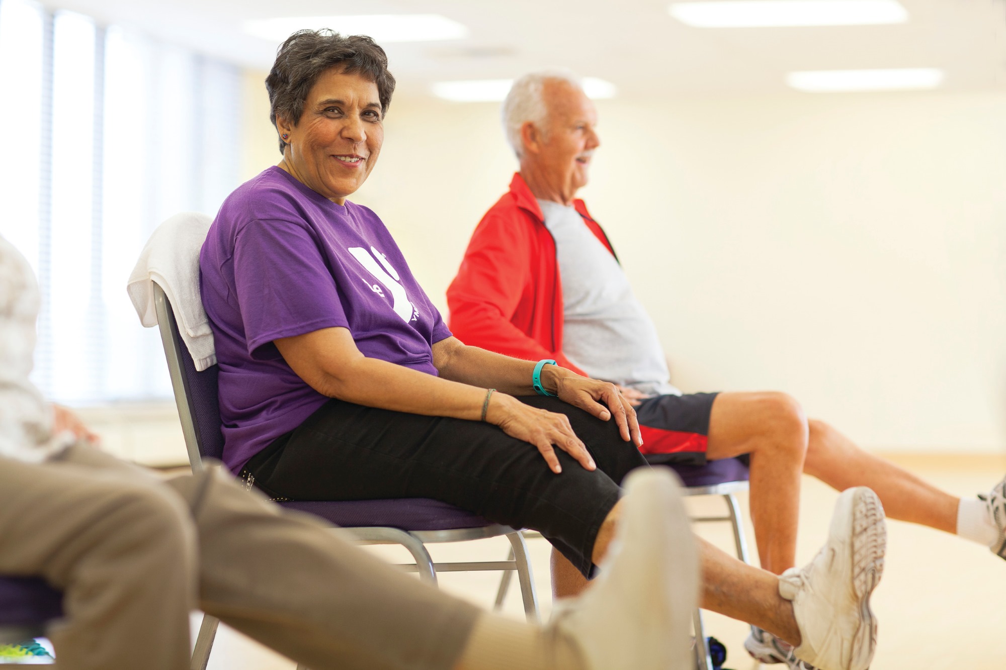 Active Older Adults preform exercises while seated in a Greater Kansas City YMCA.