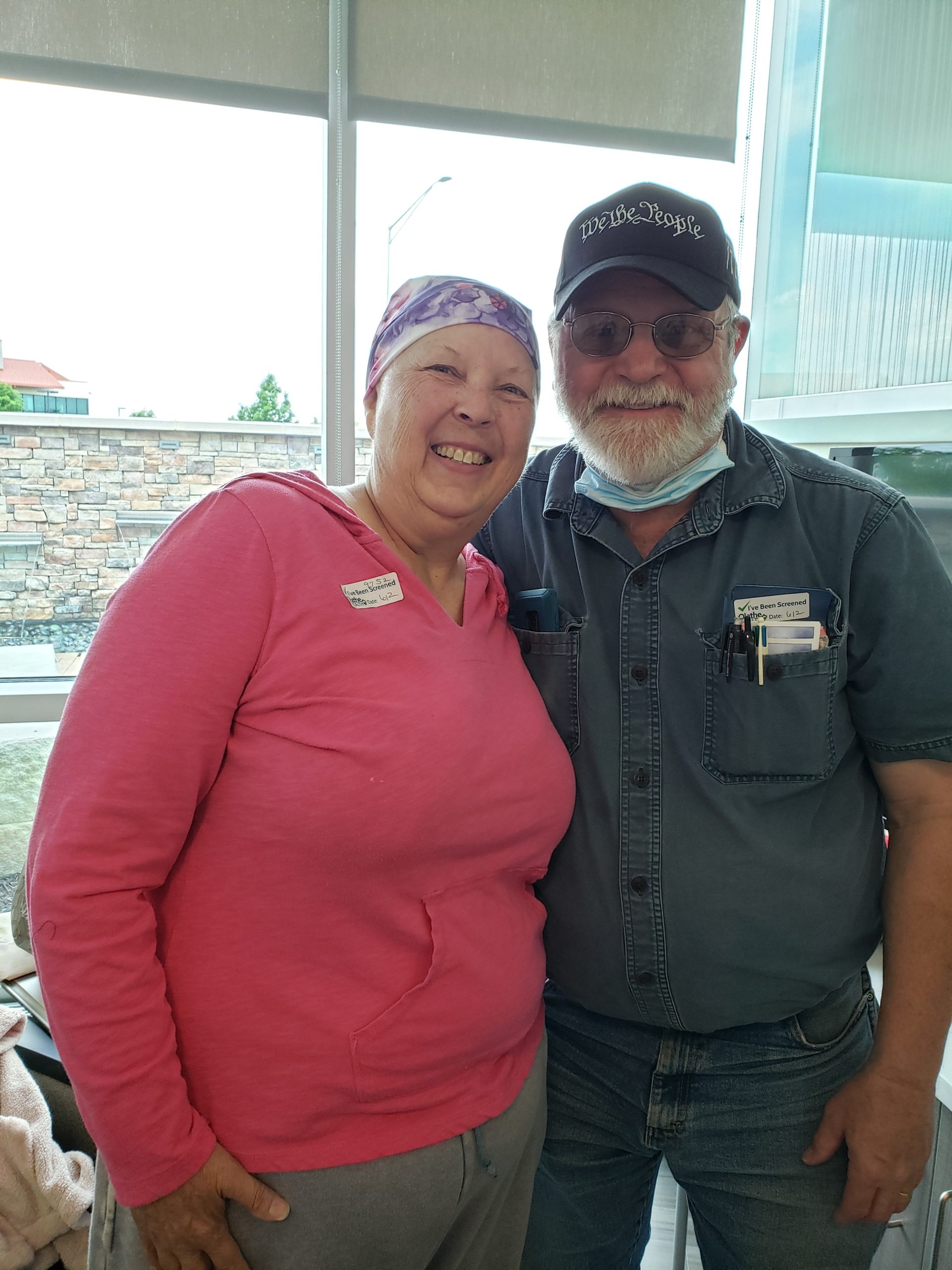 image of cancer survivor and her husband coach smiling together