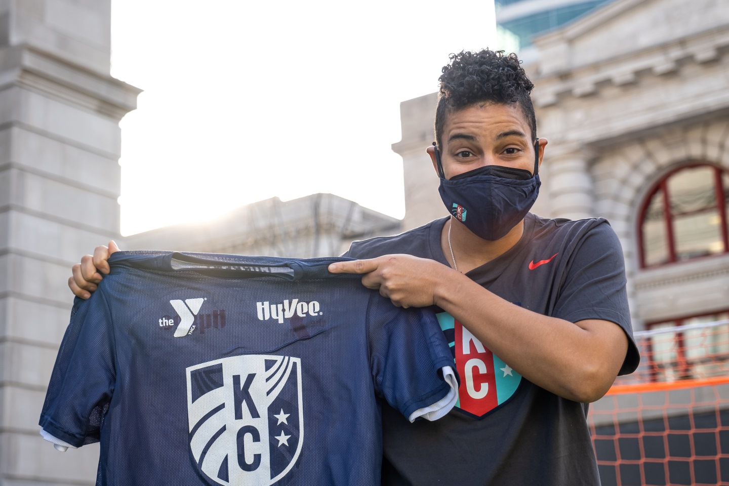 KC Current Goalkeeper Adrianna Franch holds the YMCA KC Current youth soccer jersey.