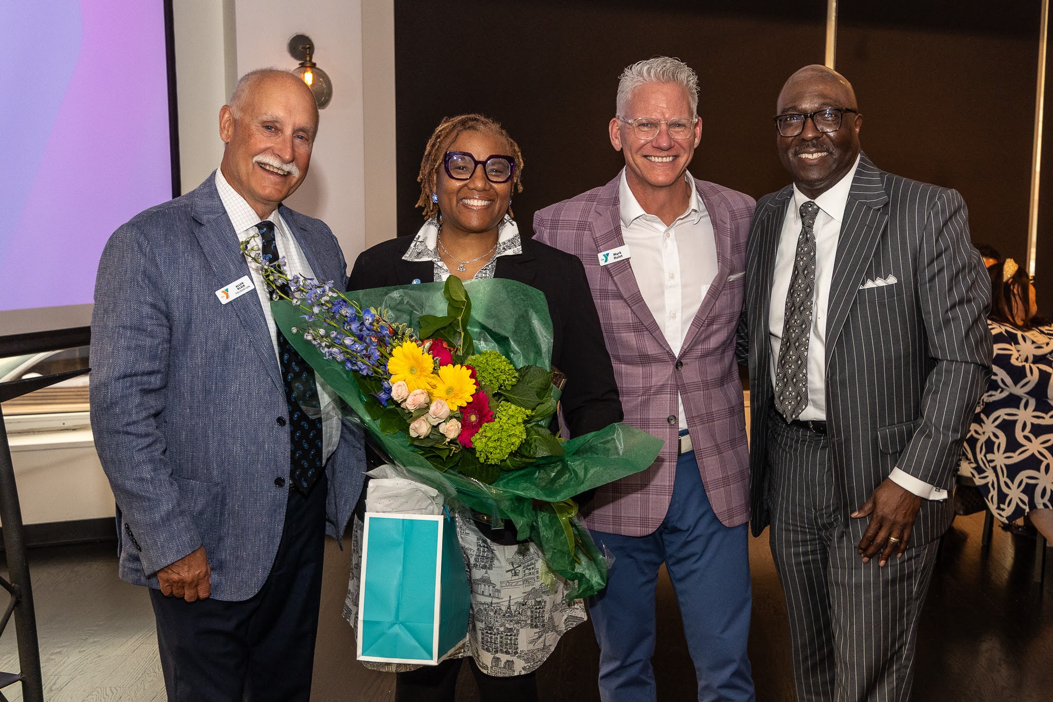 Photo of Allen Blair, YMCA Foundation President; Andrea Ellis, Kauffman Foundation; Mark Hulet, Y President and CEO; Bob Kendrick, Negro Leagues Baseball Museum President and Keynote Speaker