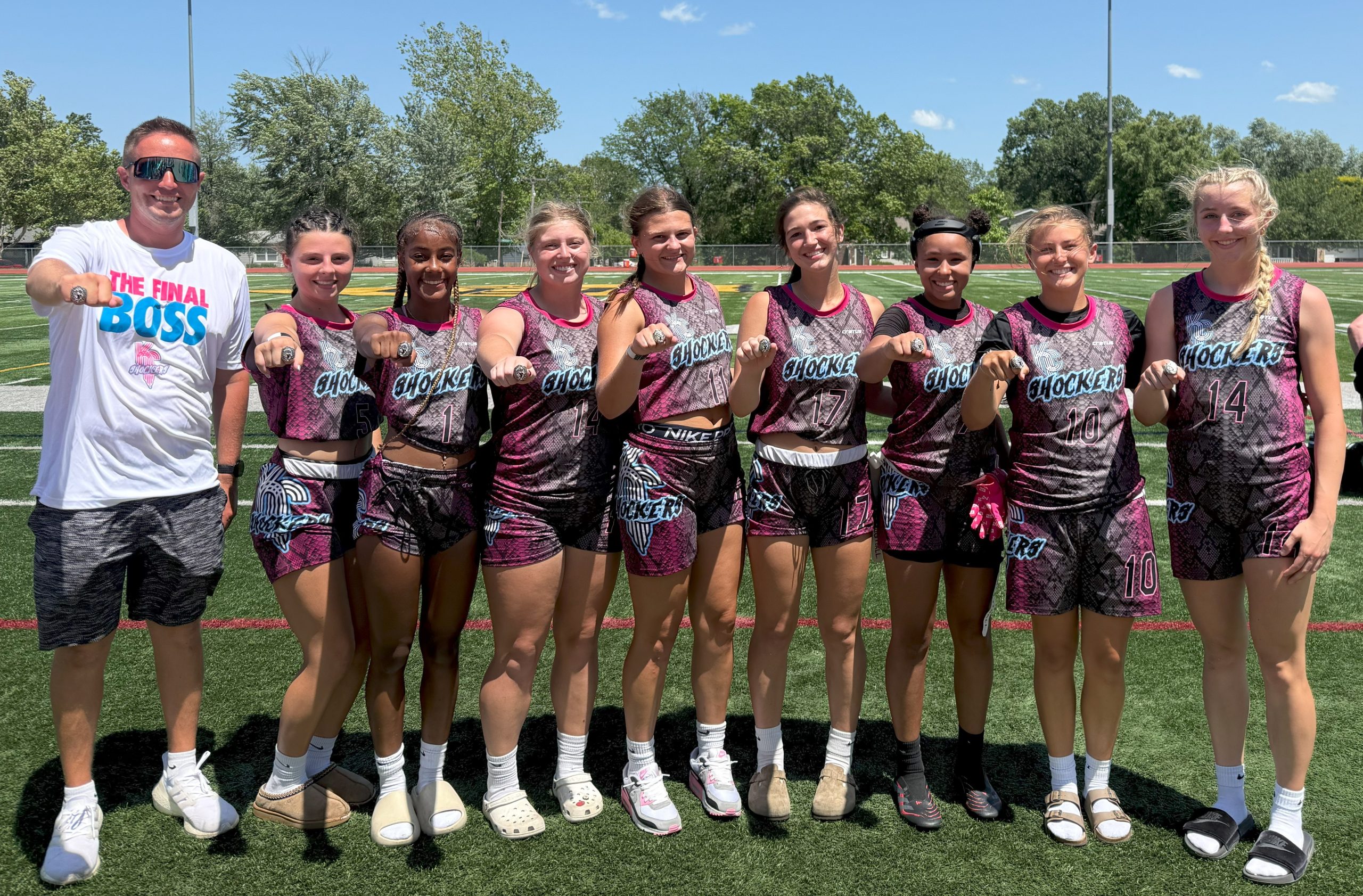 Photo of tournament champions KC Shockers high school team from the YMCA of Greater Kansas City, wearing their championship rings
