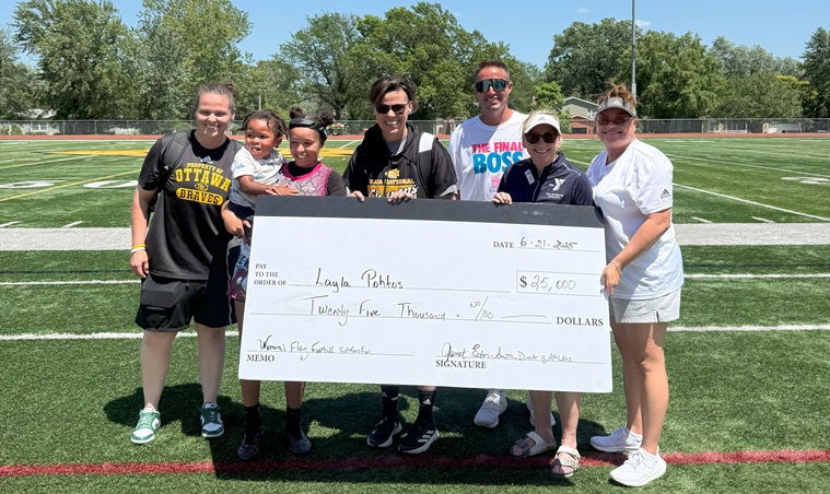 Photo of Ottawa MVP Layla Pohtos with representatives from Ottawa University and the YMCA of Greater Kansas City, holding an oversized check for her scholarship of $25,000