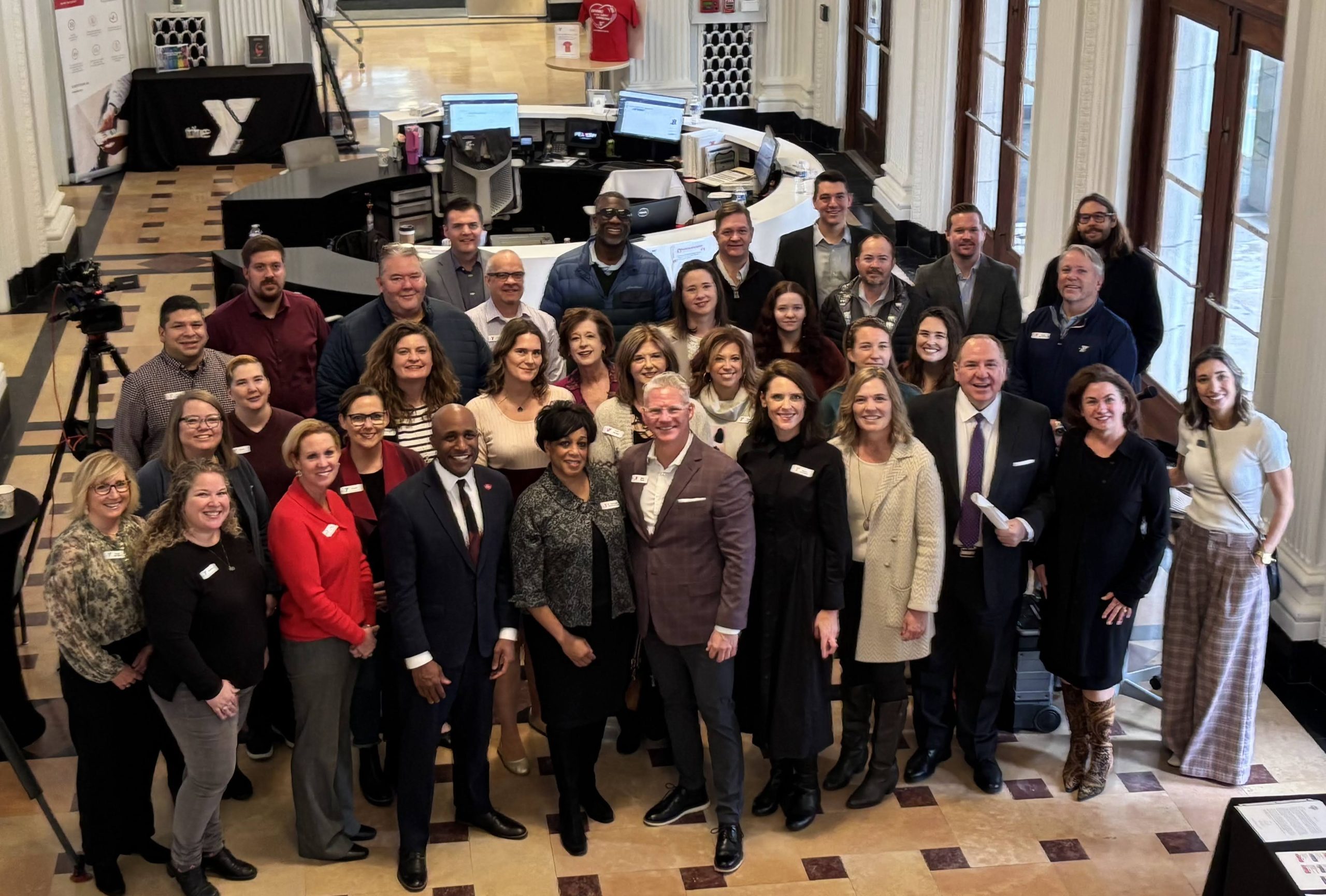 Group photo at the 165th anniversary time capsule dedication ceremony in the lobby of the Kirk Family YMCA