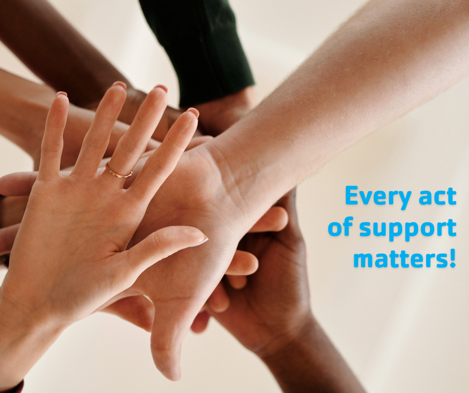 Many diverse hands stacked together in a team gesture beside the text every act of support matters