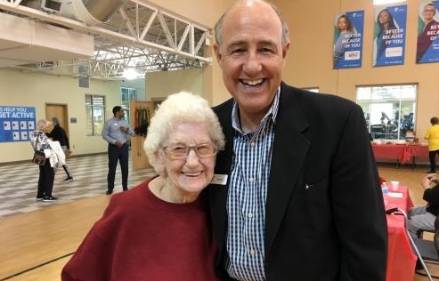 Thelma McDonnell smiles for a photo with David Byrd, Greater Kansas City YMCA President and CEO, at her 101st birthday celebration.