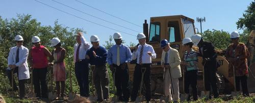 Leaders from the Y and Truman Medical Center break ground together at the new clinic site.